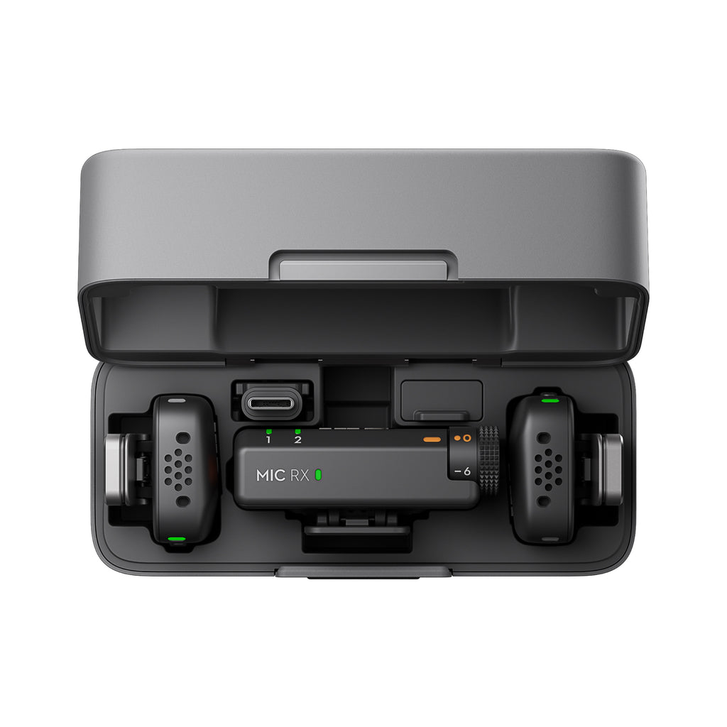 DJI Mic Mini charging case open showing transmitters and receiver