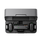 DJI Mic Mini charging case open showing transmitters and receiver