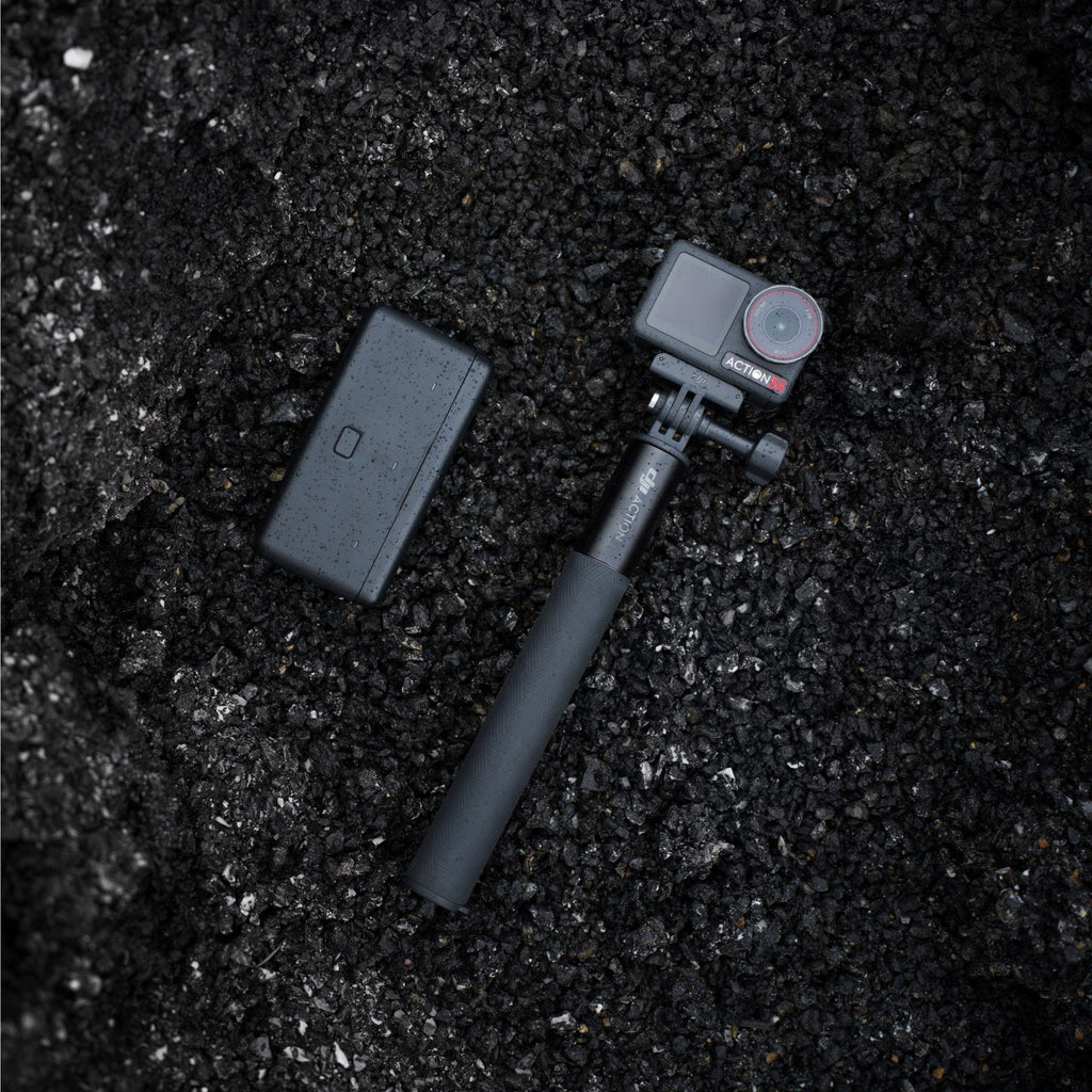 Osmo Action 5 Pro with the extension rod and battery case